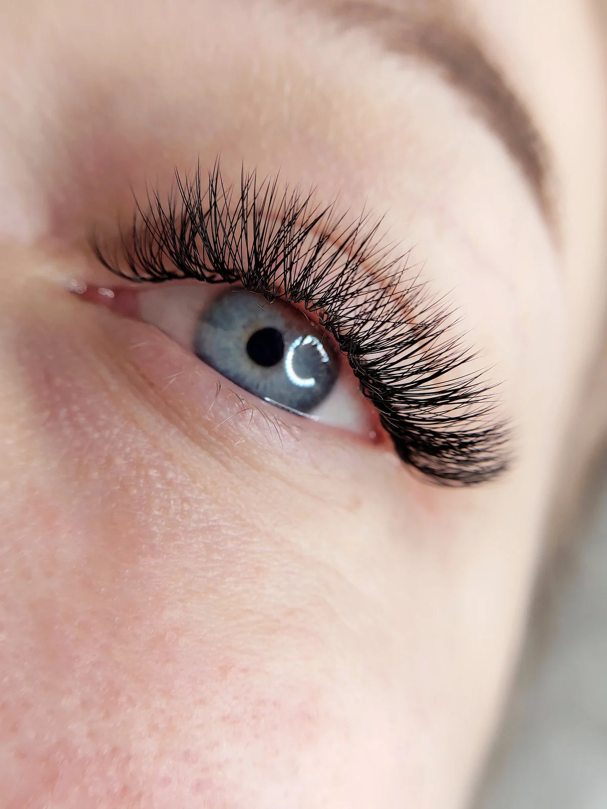 Full, natural-looking lash extensions close-up