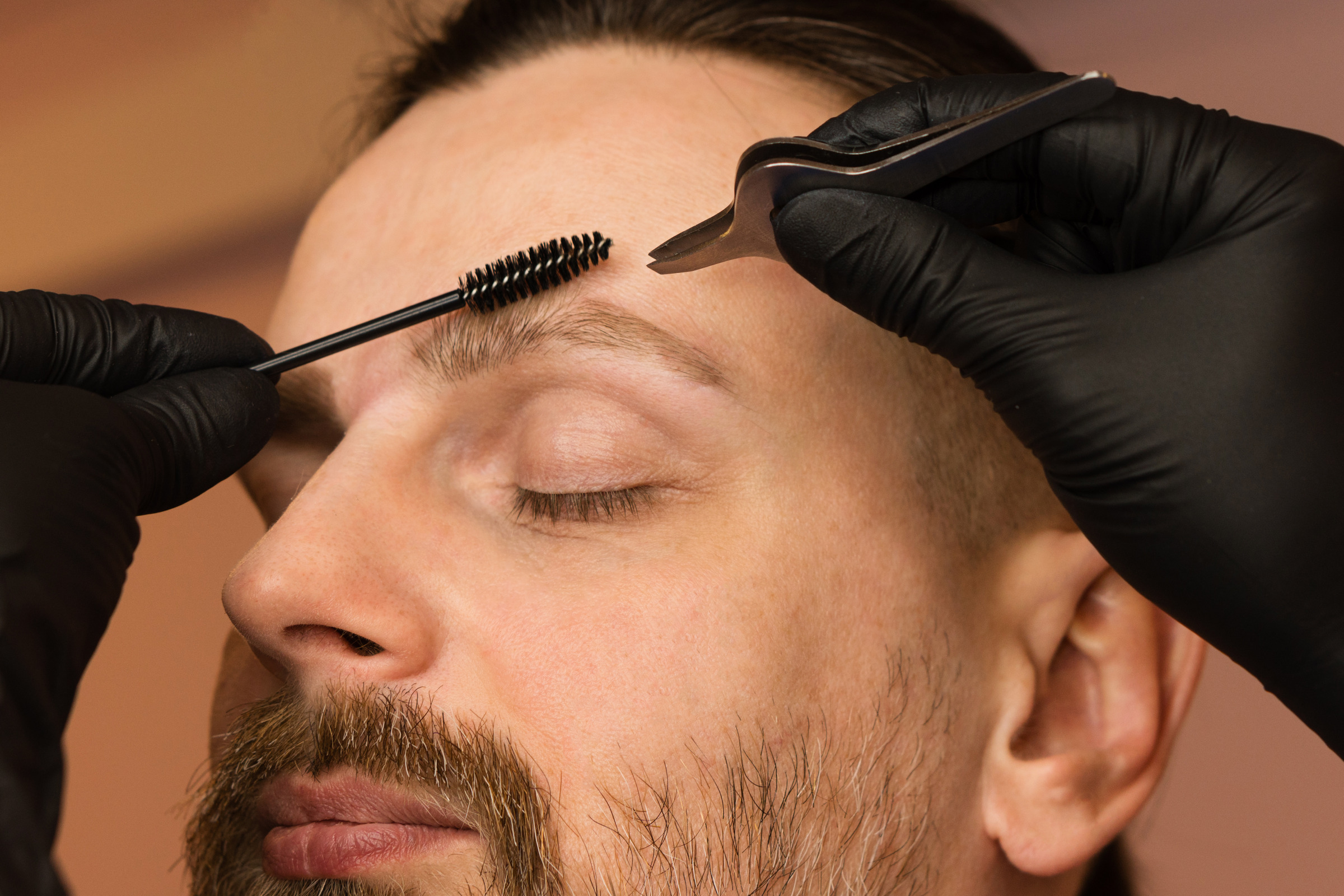 Men's eyebrow grooming and tweezing